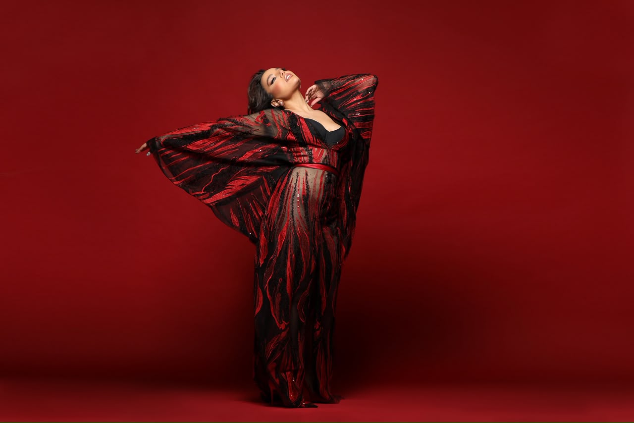 Jana Rouhana in a flowing red and black gown